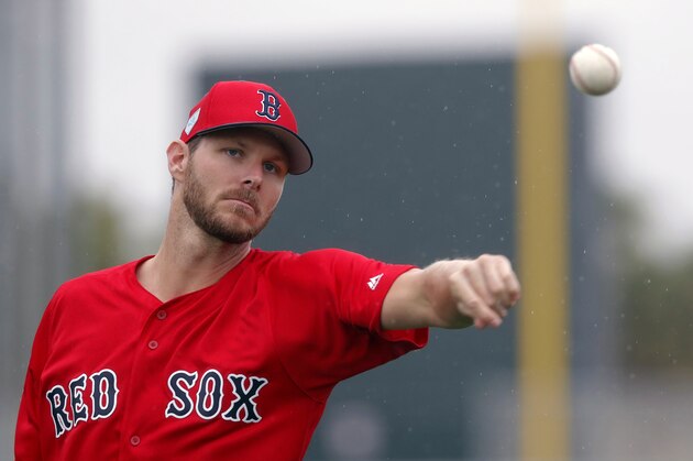 Boston Red Sox starting pitcher Chris Sale warms up as pitchers and catchers report for their first workout at their spring training baseball facility in Ft. Myers, Fla., Wednesday, Feb. 13, 2019. (AP Photo/Gerald Herbert)