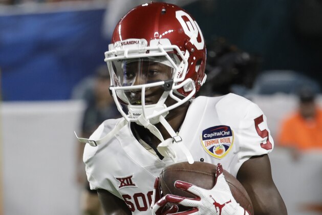 Oklahoma wide receiver Marquise Brown (5) warms up before the Orange Bowl NCAA college football game against Alabama, Saturday, Dec. 29, 2018, in Miami Gardens, Fla. (AP Photo/Lynne Sladky)