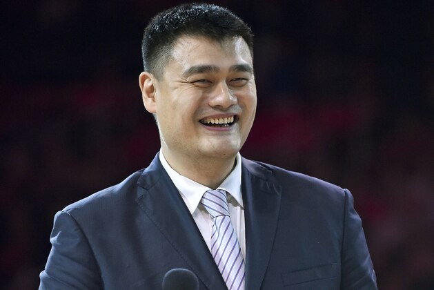 FILE - In this Friday, Feb. 3, 2017 file photo, retired Houston Rockets center Yao Ming speaks during his jersey number retirement ceremony at halftime of an NBA basketball game between the Rockets and the Chicago Bulls in Houston. The Chinese Basketball Association has voted unanimously to appoint NBA Hall of Famer Yao as its new president. (AP Photo/Eric Christian Smith, File)