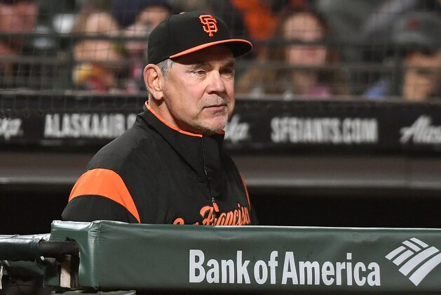 SAN FRANCISCO, CA - SEPTEMBER 14:  Manager Bruce Bochy #15 of the San Francisco Giants looks on from the dugout against the Colorado Rockies in the bottom of the eighth inning at AT&T Park on September 14, 2018 in San Francisco, California.  (Photo by Thearon W. Henderson/Getty Images)