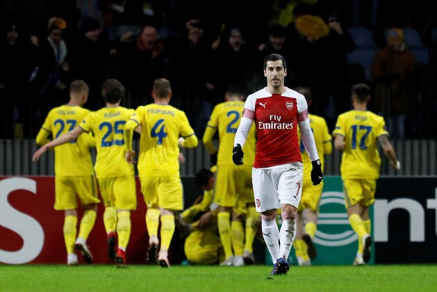 BARYSAW, BELARUS - FEBRUARY 14: Henrikh Mkhitaryan of Arsenal reacts as BATE Borisov players celebrate a goal in background during the UEFA Europa League Round of 32 First Leg match between BATE Borisov and Arsenal at Borisov-Arena on February 14, 2019 in Borisov, Belarus. (Photo by MB Media/Getty Images)