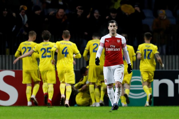 BARYSAW, BELARUS - FEBRUARY 14: Henrikh Mkhitaryan of Arsenal reacts as BATE Borisov players celebrate a goal in background during the UEFA Europa League Round of 32 First Leg match between BATE Borisov and Arsenal at Borisov-Arena on February 14, 2019 in Borisov, Belarus. (Photo by MB Media/Getty Images)