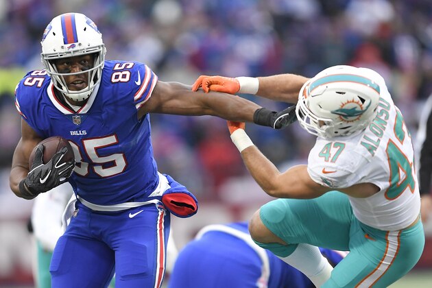 Buffalo Bills tight end Charles Clay (85) avoids Miami Dolphins outside linebacker Kiko Alonso (47) during the first half of an NFL football game, Sunday, Dec. 30, 2018, in Orchard Park, N.Y. (AP Photo/Adrian Kraus)