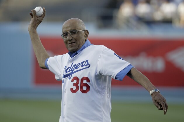 Former Los Angeles Dodgers pitcher Don Newcombe participates in the first pitch ceremony before a baseball game between the Los Angeles Dodgers and the Cleveland Indians in Los Angeles, Tuesday, July 1, 2014. (AP Photo/Chris Carlson)