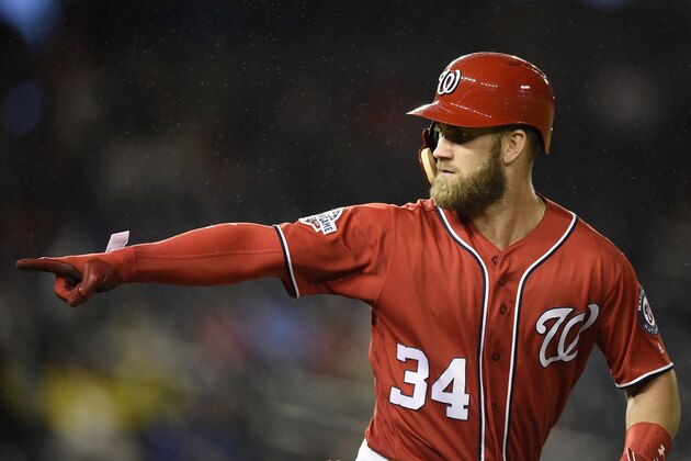 FILE - In this Sept. 8, 2018, file photo, Washington Nationals' Bryce Harper pointing to the dugout after he hit a two-run home run during the seventh inning of the second baseball game of a doubleheader against the Chicago Cubs, in Washington. As the start of spring training approaches, the Washington Nationals are waiting right along with the rest of the world to find out where Harper will be playing next season. (AP Photo/Nick Wass, File) FILE - In this Sept. 8, 2018, file photo, Washington Nationals' Bryce Harper pointing to the dugout after he hit a two-run home run during the seventh inning of the second baseball game of a doubleheader against the Chicago Cubs, in Washington. As the start of spring training approaches, the Washington Nationals are waiting right along with the rest of the world to find out where Harper will be playing next season. (AP Photo/Nick Wass, File)