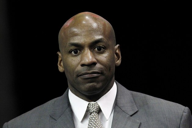 New Orleans Hornets general manager Dell Demps takes the court before an NBA basketball game against the Oklahoma City Thunder in New Orleans, Friday, Nov. 16, 2012.  Demps has agreed to a new multiyear contract extension to remain with the club and see through the roster overhaul that he and coach Monty Williams have conducted in tandem during the past two seasons. (AP Photo/Jonathan Bachman)