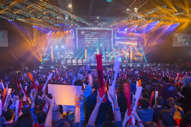 FILE - In this May 11, 2014 file photo, fans watch the opening ceremony of the League of Legends season 4 World Championship Final between South Korea against China's Royal Club, in Paris. With millions of gamers now regularly spectating video games online and in arenas, game developers are angling to learn a few lessons from esports and possibly create the next