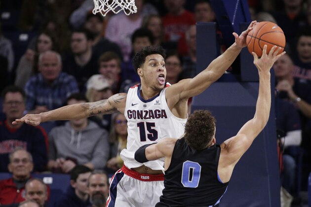 Gonzaga forward Brandon Clarke (15) blocks a shot by San Diego forward Isaiah Pineiro (0) during the second half of an NCAA college basketball game in Spokane, Wash., Saturday, Feb. 2, 2019. (AP Photo/Young Kwak)