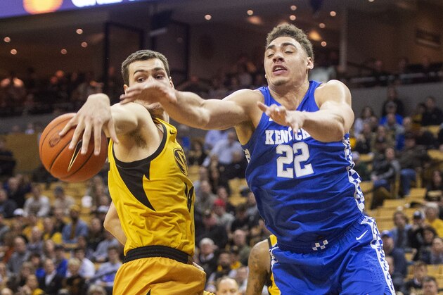 Missouri's Reed Nikko, left, and Kentucky's Reid Travis reach for a rebound during the first half of an NCAA college basketball game Tuesday, Feb. 19, 2019, in Columbia, Mo. (AP Photo/L.G. Patterson)