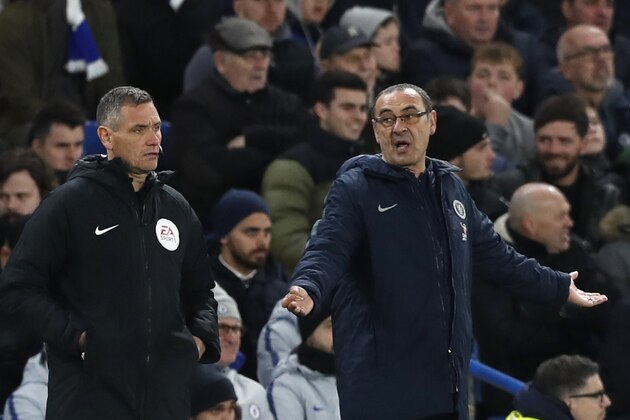 Chelsea head coach Maurizio Sarri gestures when looking at the fourth official during the English FA Cup fifth round soccer match between Chelsea and Manchester United at Stamford Bridge stadium in London, Monday, Feb. 18, 2019. (AP Photo/Alastair Grant)