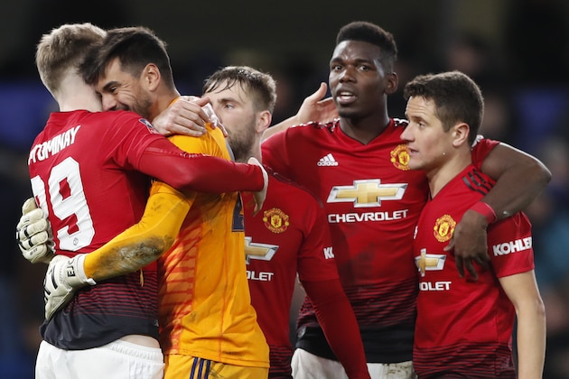 Manchester United players celebrate winning with a 2-0 score at the end of the English FA Cup fifth round soccer match between Chelsea and Manchester United at Stamford Bridge stadium in London, Monday, Feb. 18, 2019. (AP Photo/Alastair Grant)