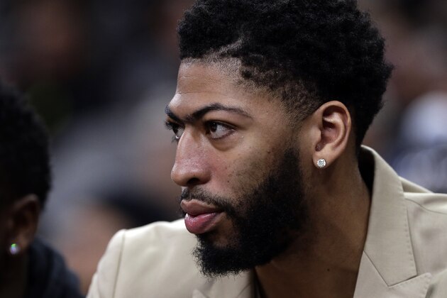 New Orleans Pelicans forward Anthony Davis watches from the bench in street clothes during the first half of the team's NBA basketball game against the San Antonio Spurs in San Antonio, Saturday, Feb. 2, 2019. (AP Photo/Eric Gay)