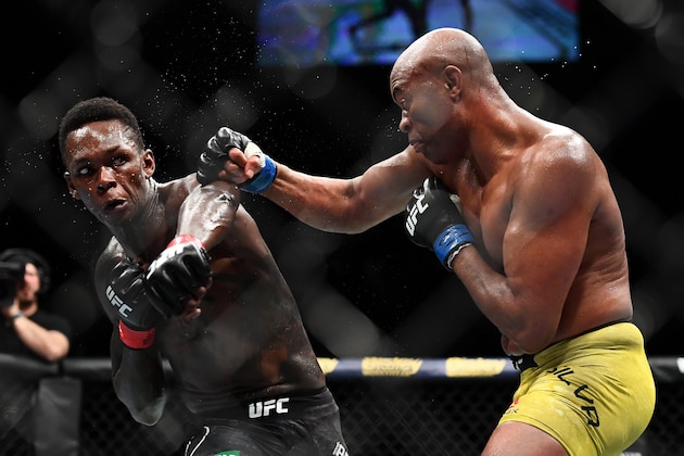 MELBOURNE, AUSTRALIA - FEBRUARY 10: Israel Adesanya of Nigeria punches Anderson Silva of Brazil during their Middleweight bout during UFC234 at Rod Laver Arena on February 10, 2019 in Melbourne, Australia. (Photo by Quinn Rooney/Getty Images)