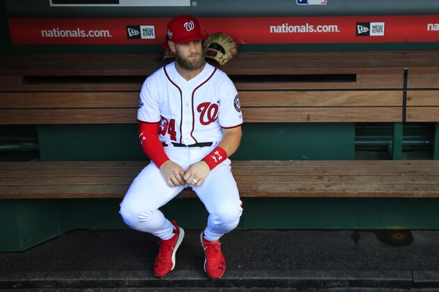 Washington Nationals Bryce Harper, looks at the baseball field from their dug out before the start of the Nationals last home game of the season against the Miami Marlins in Washington, Wednesday, Sept. 26, 2018. (AP Photo/Manuel Balce Ceneta)