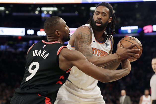 Toronto Raptors' Serge Ibaka (9) defends New York Knicks' DeAndre Jordan (6) during the second half of an NBA basketball game, Saturday, Feb. 9, 2019, in New York. The Raptors won 104-99. (AP Photo/Frank Franklin II)