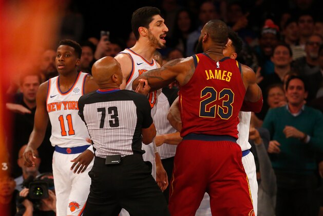 NEW YORK, NY - NOVEMBER 13:  (NEW YORK DAILIES OUT)    Enes Kanter #00 of the New York Knicks confronts LeBron James #23 of the Cleveland Cavaliers at Madison Square Garden on November 13, 2017 in New York City. The Cavaliers defeated the Knicks 104-101. NOTE TO USER: User expressly acknowledges and agrees that, by downloading and/or using this Photograph, user is consenting to the terms and conditions of the Getty Images License Agreement.  (Photo by Jim McIsaac/Getty Images)