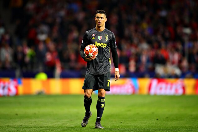 MADRID, SPAIN - FEBRUARY 20: Cristiano Ronaldo of Juventus holds the ball during the UEFA Champions League Round of 16 First Leg match between Club Atletico de Madrid and Juventus at Estadio Wanda Metropolitano on February 20, 2019 in Madrid, Spain. (Photo by Chris Brunskill/Fantasista/Getty Images)