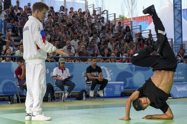Japan's b-boy Shigelix (R) competes against Russia's b-boy Bumblebee during a battle at the Youth Olympic Games in Buenos Aires, Argentina on October 08, 2018. - The Youth Olympic Games in Buenos Aires hosted the world's best youth break dancers to compete for the first ever Olympic medal in the athletic art. (Photo by EITAN ABRAMOVICH / AFP)        (Photo credit should read EITAN ABRAMOVICH/AFP/Getty Images)