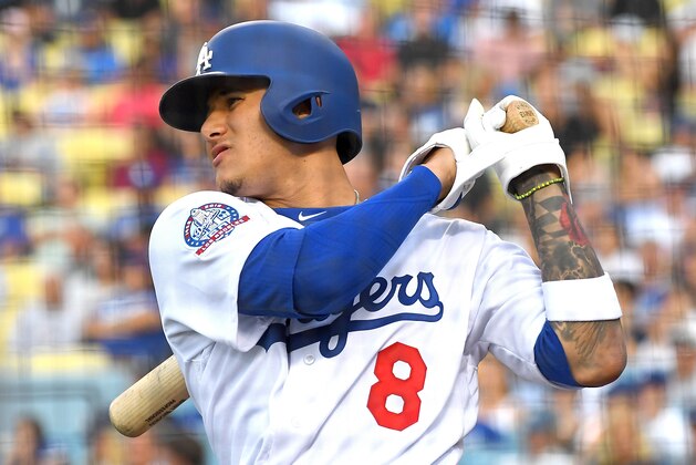 LOS ANGELES, CA - JULY 31: Manny Machado #8 of the Los Angeles Dodgers warms up in the batting circle during the game against the Milwaukee Brewers at Dodger Stadium on July 31, 2018 in Los Angeles, California.  (Photo by Jayne Kamin-Oncea/Getty Images)'n