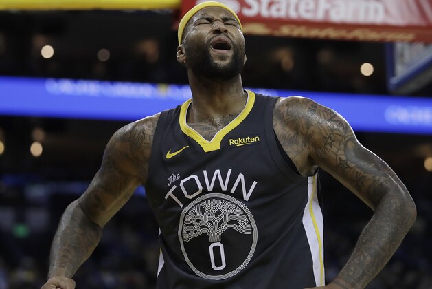 Golden State Warriors' DeMarcus Cousins celebrates a score against the San Antonio Spurs during the second half of an NBA basketball game Wednesday, Feb. 6, 2019, in Oakland, Calif. (AP Photo/Ben Margot)