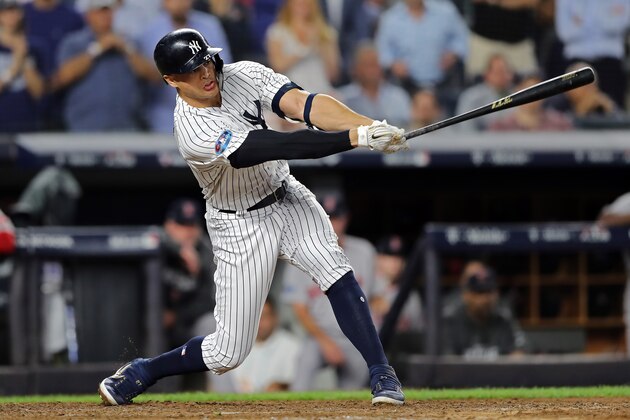 NEW YORK, NEW YORK - OCTOBER 09:  Giancarlo Stanton #27 of the New York Yankees strikes out in the ninth inning against the Boston Red Sox during Game Four American League Division Series at Yankee Stadium on October 09, 2018 in the Bronx borough of New York City. (Photo by Elsa/Getty Images)