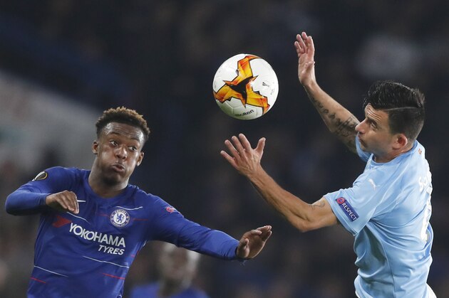 Chelsea's Callum Hudson-Odoi, left, and Malmo's Behrang Safari vie for the ball during the round of 32, second leg, Europa League soccer match between Chelsea and Malmo FF at Stamford Bridge stadium in London, Thursday Feb. 21, 2019. (AP Photo/Frank Augstein)