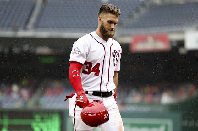 Washington Nationals' Bryce Harper walks to the dugout after fouling out to third base to end the sixth inning of a baseball game between the Washington Nationals and the New York Mets at Nationals Park, Sunday, Sept. 23, 2018, in Washington. The Mets won 8-6. (AP Photo/Andrew Harnik)