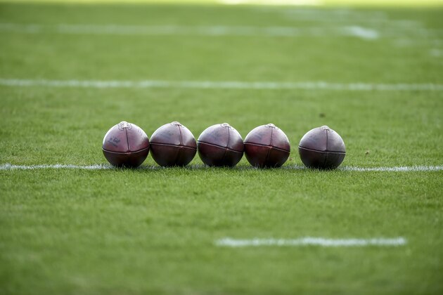 Footballs sit on the field prior to an NFL football game between the Carolina Panthers and the Seattle Seahawks in Charlotte, N.C., Sunday, Nov. 25, 2018. (AP Photo/Mike McCarn)