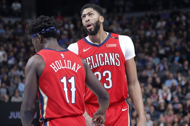 SACRAMENTO, CA - DECEMBER 23: Jrue Holiday #11 of the New Orleans Pelicans high-fives Anthony Davis #23 of the New Orleans Pelicans on December 23, 2018 at Golden 1 Center in Sacramento, California. NOTE TO USER: User expressly acknowledges and agrees that, by downloading and or using this Photograph, user is consenting to the terms and conditions of the Getty Images License Agreement. Mandatory Copyright Notice: Copyright 2018 NBAE (Photo by Rocky Widner/NBAE via Getty Images)