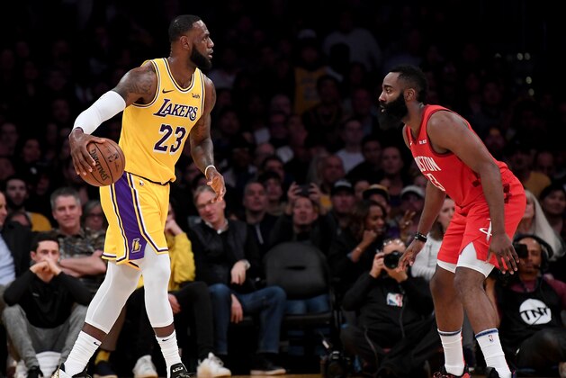 LOS ANGELES, CALIFORNIA - FEBRUARY 21:  LeBron James #23 of the Los Angeles Lakers dribbles toward James Harden #13 of the Houston Rockets during the first half at Staples Center on February 21, 2019 in Los Angeles, California. (Photo by Harry How/Getty Images)