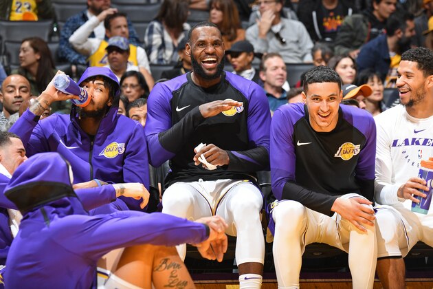 LOS ANGELES, CA - DECEMBER 2: Brandon Ingram #14, LeBron James #23 and Kyle Kuzma #0 of the Los Angeles Lakers smile and laugh on the bench during the game against the Phoenix Suns on December 2, 2018 at STAPLES Center in Los Angeles, California. NOTE TO USER: User expressly acknowledges and agrees that, by downloading and/or using this Photograph, user is consenting to the terms and conditions of the Getty Images License Agreement. Mandatory Copyright Notice: Copyright 2018 NBAE (Photo by Andrew D. Bernstein/NBAE via Getty Images)