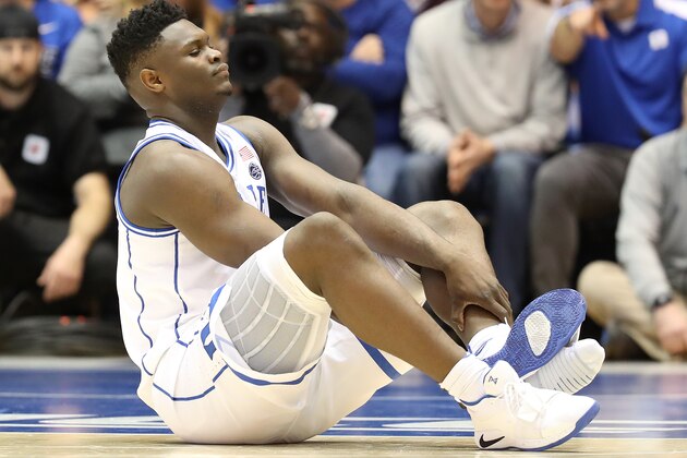 DURHAM, NORTH CAROLINA - FEBRUARY 20: Zion Williamson #1 of the Duke Blue Devils reacts after falling as his shoe breaks during their game against the North Carolina Tar Heels at Cameron Indoor Stadium on February 20, 2019 in Durham, North Carolina. (Photo by Streeter Lecka/Getty Images)