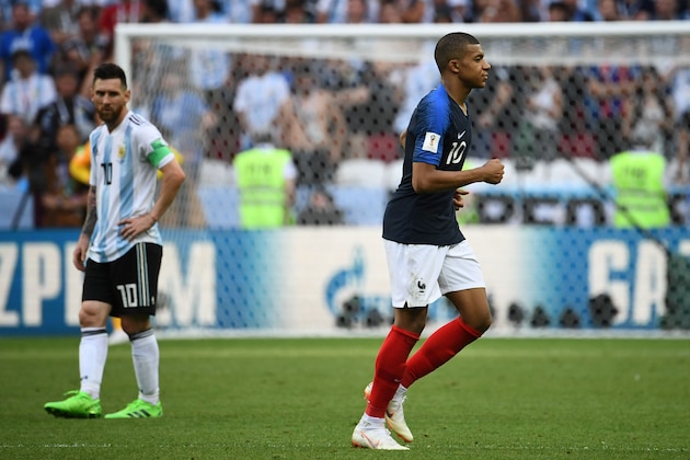 France's forward Kylian Mbappe (R) leaves the pitch as Argentina's Lionel Messi looks on during the Russia 2018 World Cup round of 16 football match between France and Argentina at the Kazan Arena in Kazan on June 30, 2018. (Photo by FRANCK FIFE / AFP) / RESTRICTED TO EDITORIAL USE - NO MOBILE PUSH ALERTS/DOWNLOADS        (Photo credit should read FRANCK FIFE/AFP/Getty Images)