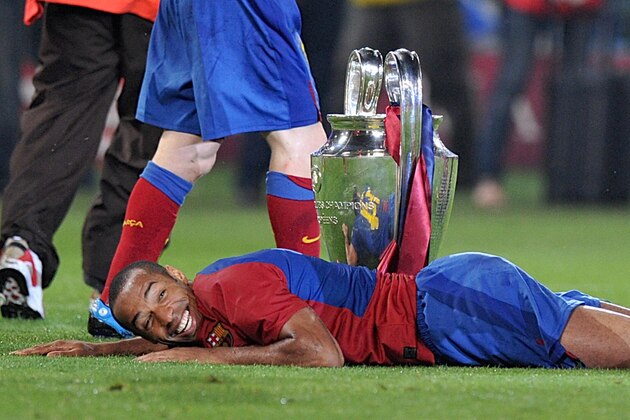 Barcelona´s French forward Thierry Henry celebrates with the Champions League Cup after the trophy ceremony on May 27, 2009 at the Olympic Stadium in Rome. Barcelona defeated  Manchester United 2-0 in the final of the UEFA football Champions League.    AFP PHOTO / CHRISTOPHE SIMON (Photo credit should read CHRISTOPHE SIMON/AFP/Getty Images)