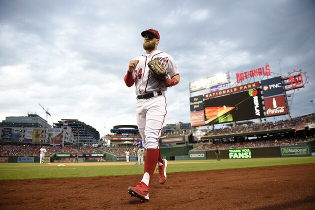 Washington Nationals right fielder Bryce Harper comes in from the outfield to the dugout during the middle of the eighth inning of a baseball game against the New York Mets, Saturday, Sept. 22, 2018, in Washington. The Nationals won 6-0.(AP Photo/Nick Wass)