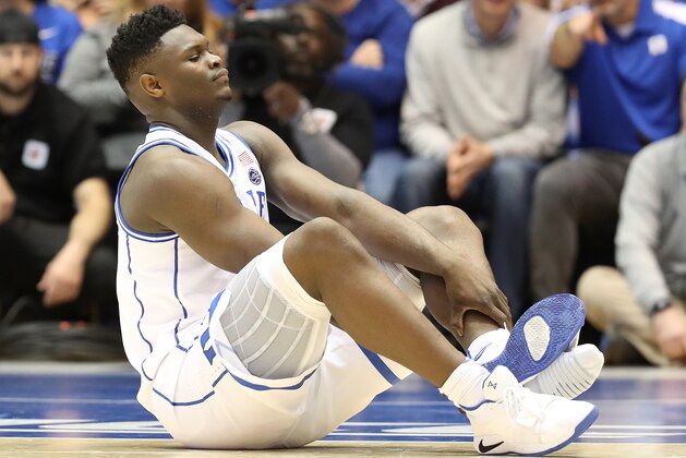 DURHAM, NORTH CAROLINA - FEBRUARY 20: Zion Williamson #1 of the Duke Blue Devils reacts after falling as his shoe breaks during their game against the North Carolina Tar Heels at Cameron Indoor Stadium on February 20, 2019 in Durham, North Carolina. (Photo by Streeter Lecka/Getty Images)