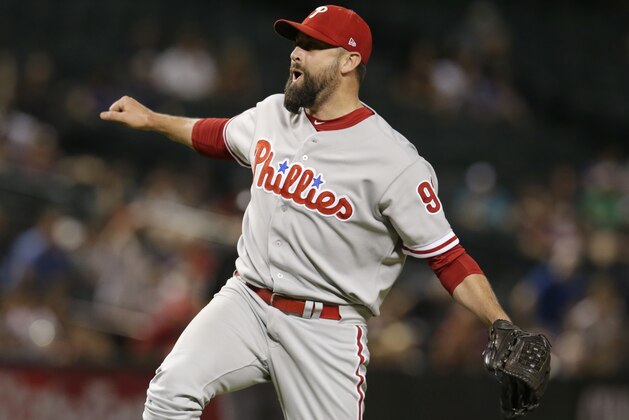Philadelphia Phillies' Pat Neshek reacts after the final out in the team's 5-2 win over the Arizona Diamondbacks in a baseball game Tuesday, Aug. 7, 2018, in Phoenix. (AP Photo/Rick Scuteri)