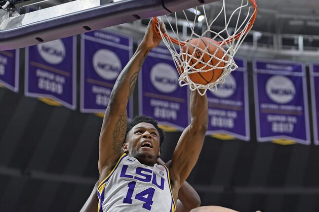 LSU guard Marlon Taylor (14) dunks the ball on a put back over Tennessee forward Grant Williams (2) in the first half of an NCAA college basketball game, Saturday, Feb. 23, 2019, in Baton Rouge, La. (AP Photo/Bill Feig)