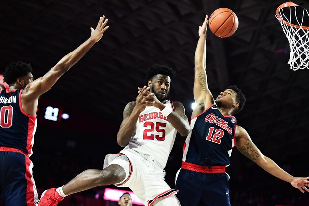 ATHENS, GEORGIA - FEBRUARY 09:  Amanze Ngumezi #25 of the Georgia Bulldogs and Bruce Stevens #12 of the Mississippi Rebels go up for a loose ball at Stegeman Coliseum on February 09, 2019 in Athens, Georgia. (Photo by Logan Riely/Getty Images)