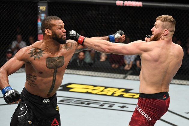 PRAGUE, CZECH REPUBLIC - FEBRUARY 23:  (R-L) Jan Blachowicz of Poland and Thiago Santos of Brazil trade punches in their light heavyweight bout during the UFC Fight Night event at O2 Arena on February 23, 2019 in the Prague, Czech Republic. (Photo by Jeff Bottari/Zuffa LLC/Zuffa LLC via Getty Images)