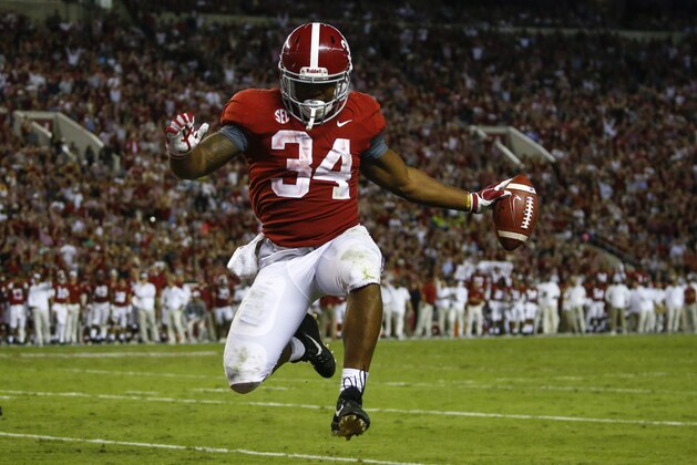 Alabama running back Damien Harris (34) leaps into the end zone for a touchdown during the second half of an NCAA college football game against Missouri, Saturday, Oct. 13, 2018, in Tuscaloosa, Ala. Alabama won 39-10. (AP Photo/Butch Dill)