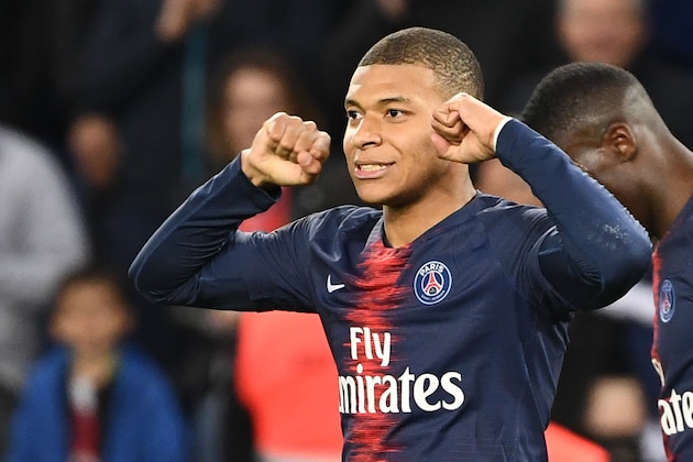 Paris Saint-Germain's French forward Kylian Mbappe celebrates scoring his team's third goal during the French L1 football match between Paris Saint-Germain and Nimes at the Parc de Princes in Paris on 23 February 2019. (Photo by FRANCK FIFE / AFP)        (Photo credit should read FRANCK FIFE/AFP/Getty Images)