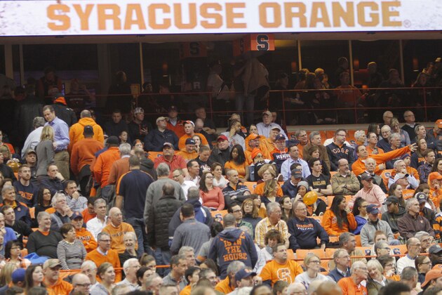 Frustrated Syracuse fans leave the Carrier Dome with several minutes left in an NCAA college basketball game against St. John's in Syracuse, N.Y., Wednesday, Dec. 21, 2016. St. John's won 93-60. (AP Photo/Nick Lisi)