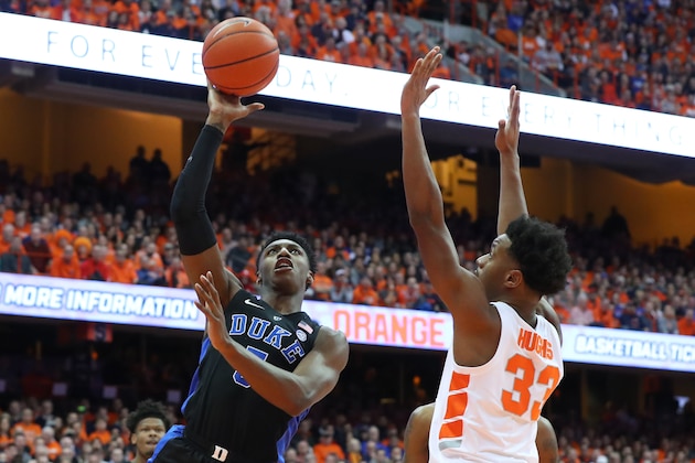 SYRACUSE, NY - FEBRUARY 23:  RJ Barrett #5 of the Duke Blue Devils shoots the ball around Elijah Hughes #33 of the Syracuse Orange during the first half at the Carrier Dome on February 23, 2019 in Syracuse, New York. (Photo by Rich Barnes/Getty Images)