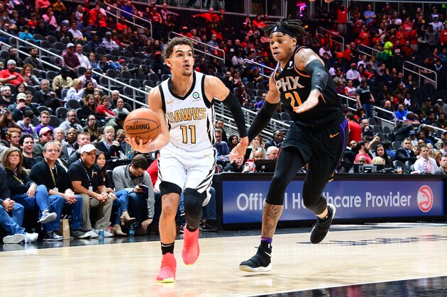 ATLANTA, GA - FEBRUARY 23: Trae Young #11 of the Atlanta Hawks drives to the basket against the Phoenix Suns on February 23, 2019 at State Farm Arena in Atlanta, Georgia.  NOTE TO USER: User expressly acknowledges and agrees that, by downloading and/or using this Photograph, user is consenting to the terms and conditions of the Getty Images License Agreement. Mandatory Copyright Notice: Copyright 2019 NBAE (Photo by Scott Cunningham/NBAE via Getty Images)