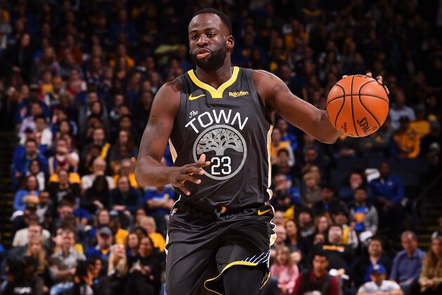 OAKLAND, CA - FEBRUARY 23: Draymond Green #23 of the Golden State Warriors handles the ball against the Houston Rockets on February 23, 2019 at ORACLE Arena in Oakland, California. NOTE TO USER: User expressly acknowledges and agrees that, by downloading and or using this photograph, User is consenting to the terms and conditions of the Getty Images License Agreement. Mandatory Copyright Notice: Copyright 2019 NBAE (Photo by Noah Graham/NBAE via Getty Images)