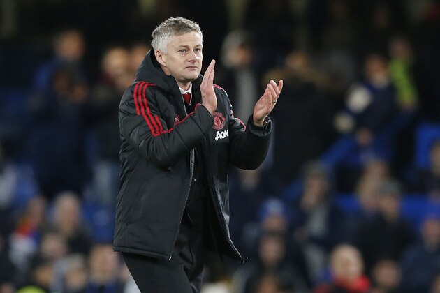 Manchester United's  Norwegian caretaker manager Ole Gunnar Solskjaer applauds supporters on the pitch after the English FA Cup fifth round football match between Chelsea and Manchester United at Stamford Bridge in London on February 18, 2019. - Manchester United won the game 2-0. (Photo by Ian KINGTON / AFP) / RESTRICTED TO EDITORIAL USE. No use with unauthorized audio, video, data, fixture lists, club/league logos or 'live' services. Online in-match use limited to 120 images. An additional 40 images may be used in extra time. No video emulation. Social media in-match use limited to 120 images. An additional 40 images may be used in extra time. No use in betting publications, games or single club/league/player publications. /         (Photo credit should read IAN KINGTON/AFP/Getty Images)