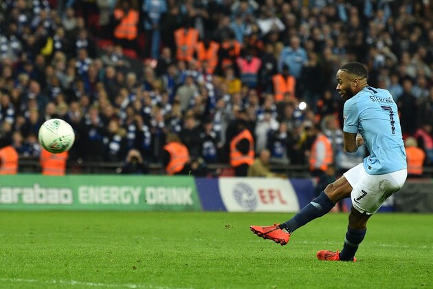 Manchester City's English midfielder Raheem Sterling scores the winning penalty in the penalty shootout at the end of the English League Cup final football match between Manchester City and Chelsea at Wembley stadium in north London on February 24, 2019. (Photo by Glyn KIRK / AFP) / RESTRICTED TO EDITORIAL USE. No use with unauthorized audio, video, data, fixture lists, club/league logos or 'live' services. Online in-match use limited to 75 images, no video emulation. No use in betting, games or single club/league/player publications. /         (Photo credit should read GLYN KIRK/AFP/Getty Images)