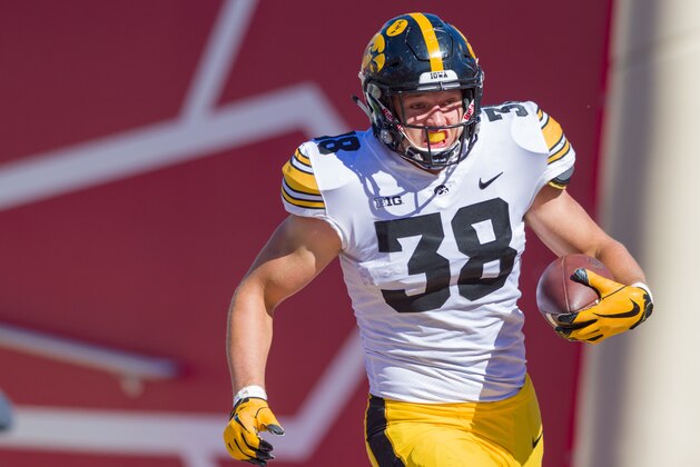 Iowa tight end T.J. Hockenson (38) rushes the ball into the end zone to score during the second half of an NCAA college football game against Indiana Saturday, Oct. 13, 2018, in Bloomington, Ind. Iowa won 42-16. (AP Photo/Doug McSchooler)