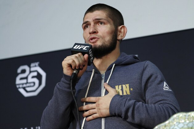 FILE - In this Saturday, Oct. 6, 2018 file photo Khabib Nurmagomedov speaks at a news conference after the UFC 229 mixed martial arts event in Las Vegas. UFC champion Khabib Nurmagomedov is probably the best-known Muslim athlete in Russia, and he's rapidly becoming a leading conservative voice at home. When a National Guardsman was killed while apparently trying to break up a fight outside an establishment variously described as a cafe and nightclub early Sunday morning, Nurmagomedov called for a crackdown on the local nightlife in his mostly-Muslim home region of Dagestan.(AP Photo/John Locher, File)
